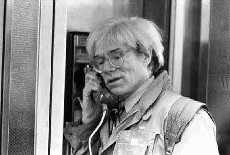 Andy Warhol on a public payphone in New York, 1982