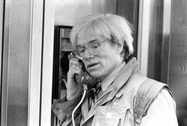 Andy Warhol in a public phone boot