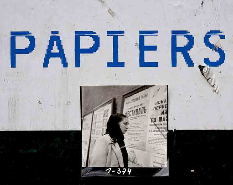 Black and White photography re photographed on a wall reading Papiers