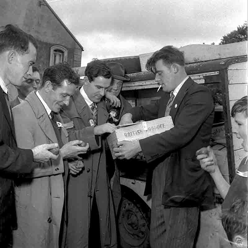 A group of Irish rejoice from a shipment of tomatoes from Britain