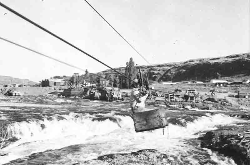 Celilo Falls on the Columbia River, Oregon, Native American fishermen on wooden scaffolding platforms, 1956. Photograph by Peter Bock-Schroeder.