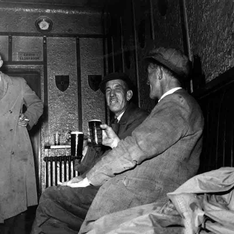 2 men drinking Guiness in an Irish Pub