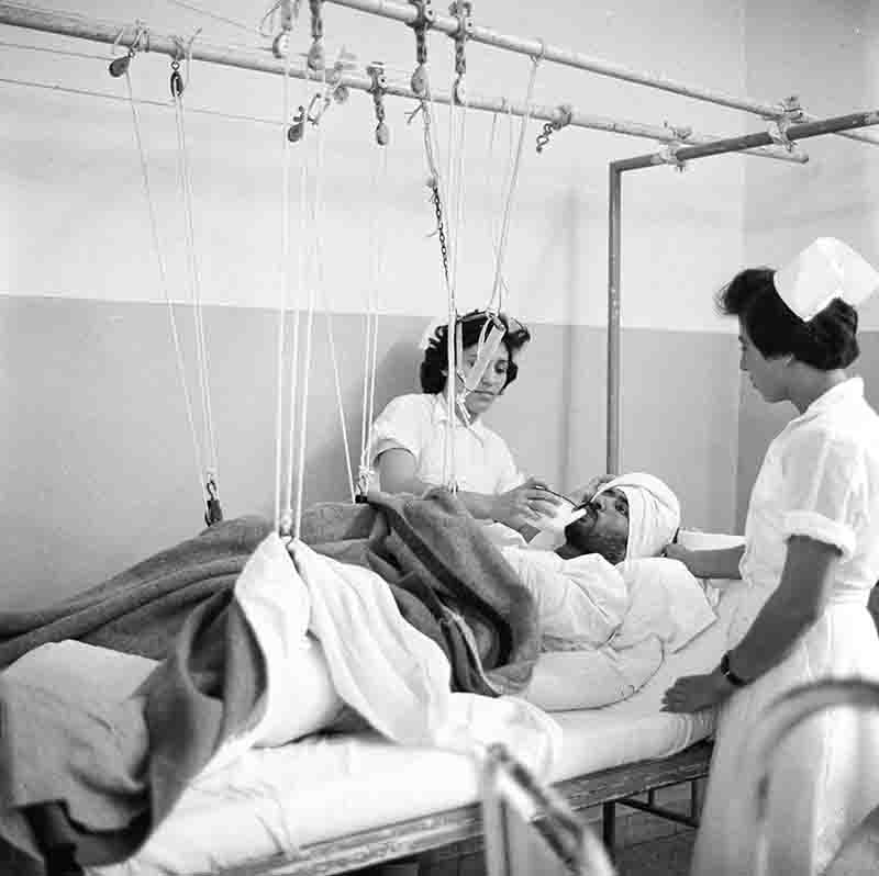 Israeli nurses attending injured Israeli soldier, 1956