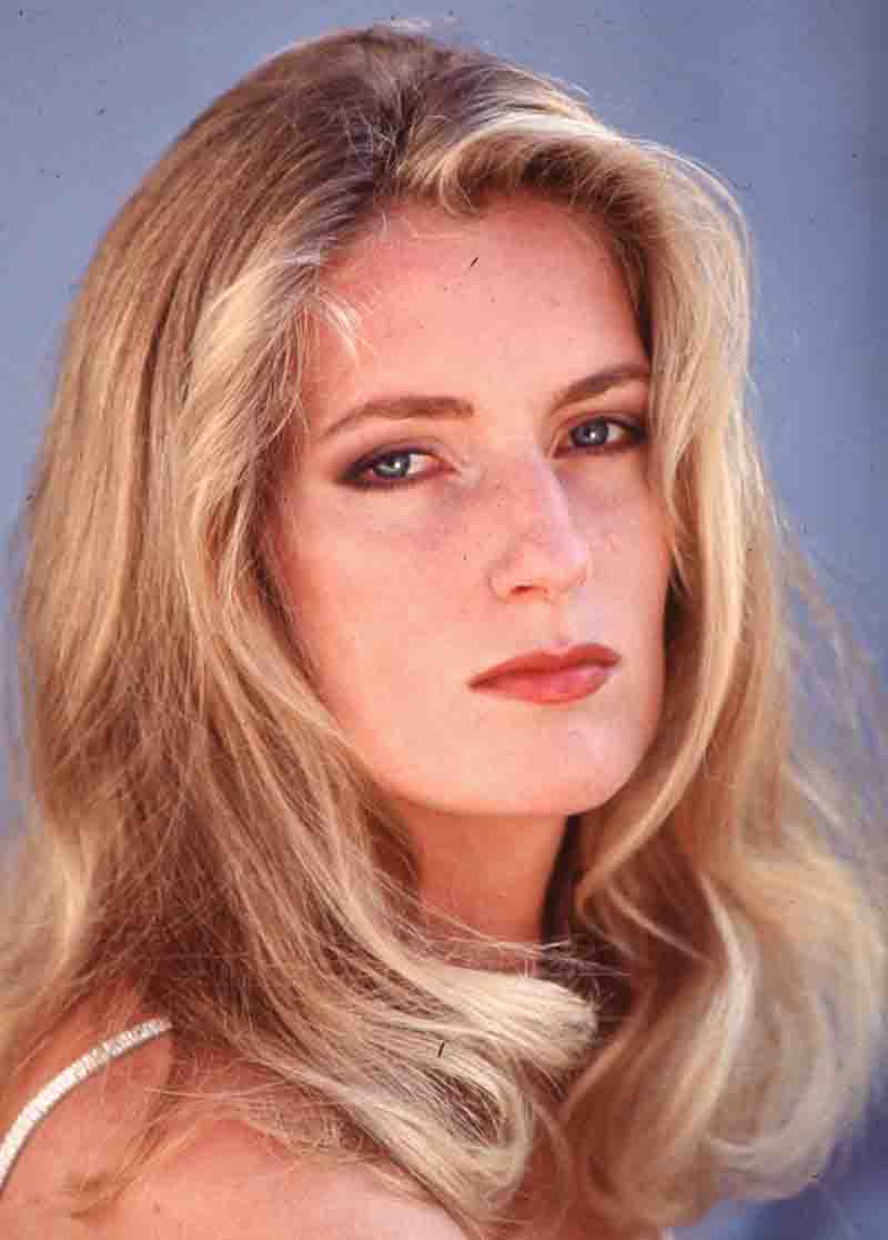Close-up portrait of Maria Furtwängler with long blonde hair, blue eyes, and red lipstick, photographed by Ingeborg Bock-Schroeder.