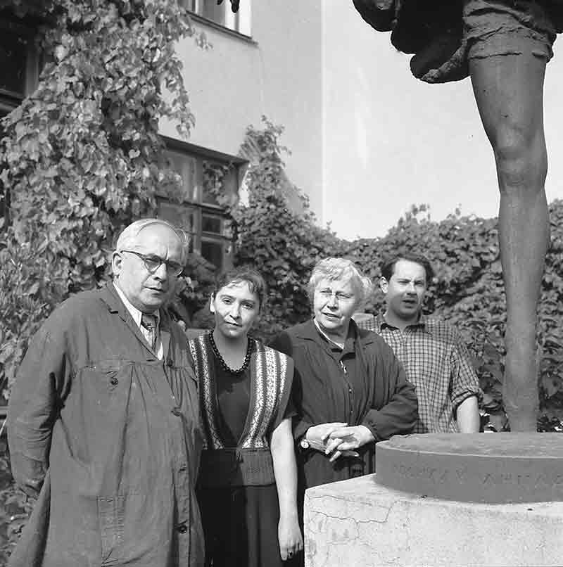 Group of artists with their sculpture