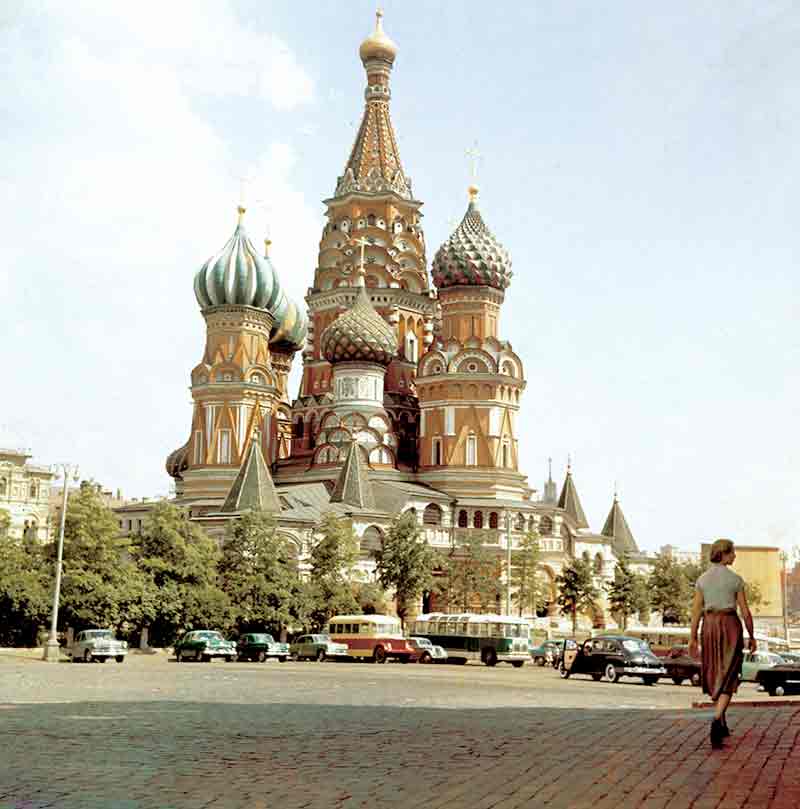 Woman walks towards the Saint Basil's Cathedral in Moscow, Russia