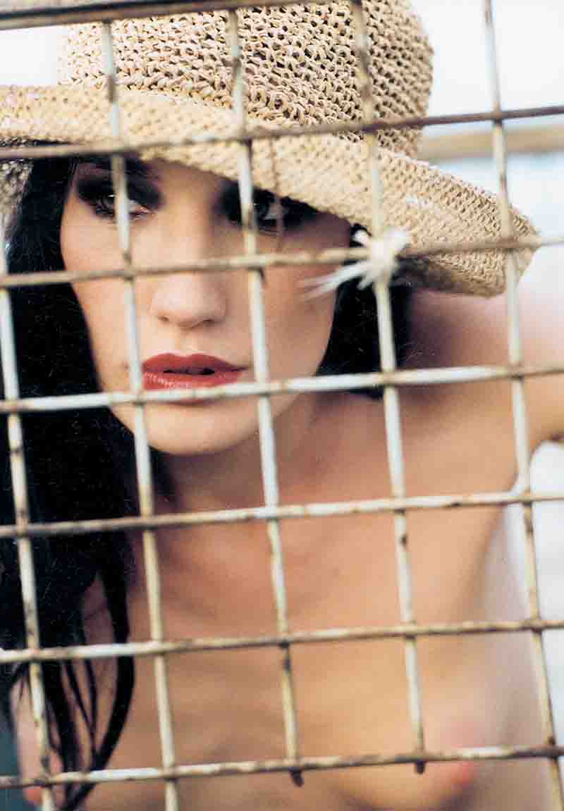 naked girl in a cage
