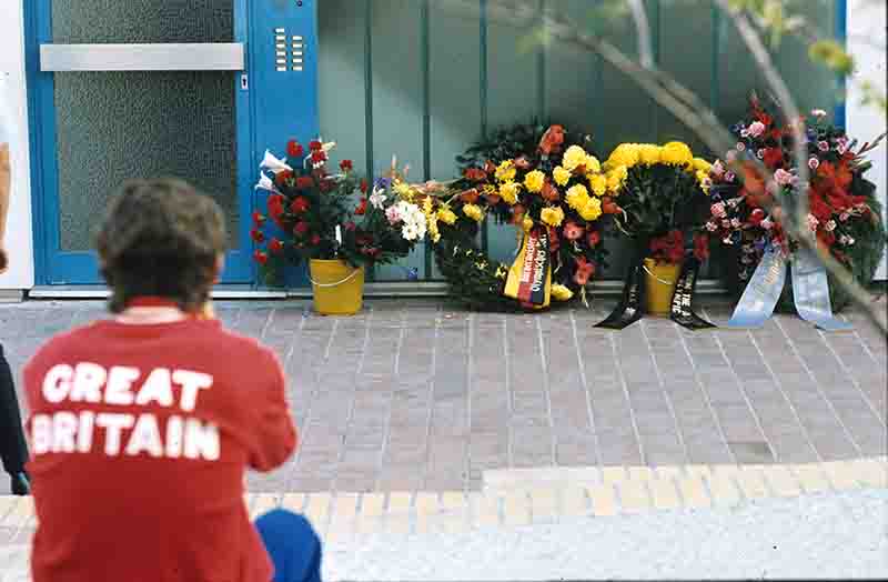Visitors to the Olympic Games lay wreaths and flowers at the site of the attacks