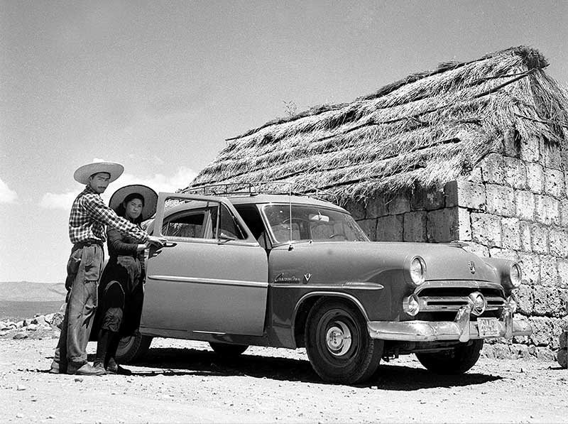 Couple in front of their car