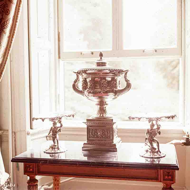 Silverware on an antique wooden table at Kaiser Wilhelm II's last residence in Doorn, Holland