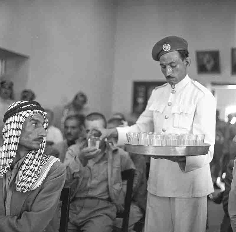 Defendants are offered a glass of water during the trial in Amman, Jordan after attempted military coup against King Hussein of Jordan